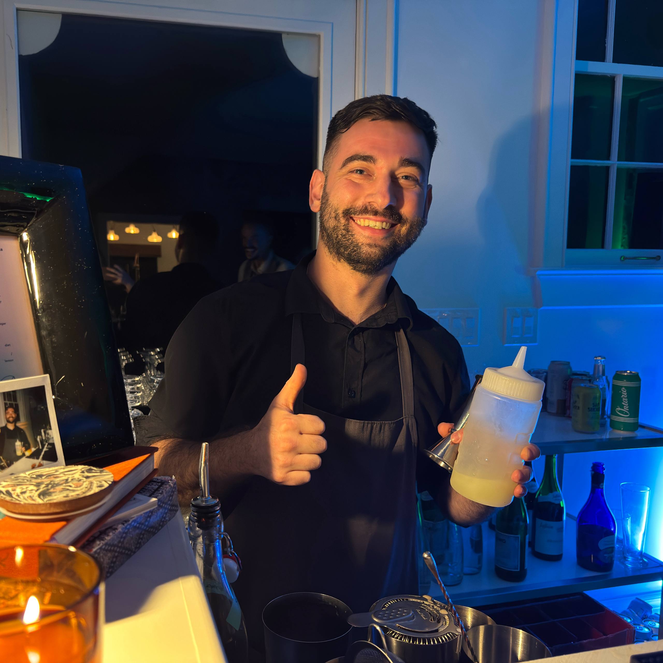 Professional bartender pouring cocktail